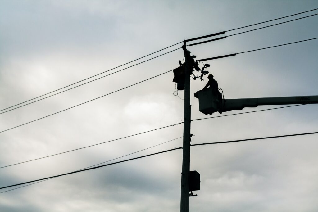 the linesmen work on the power lines