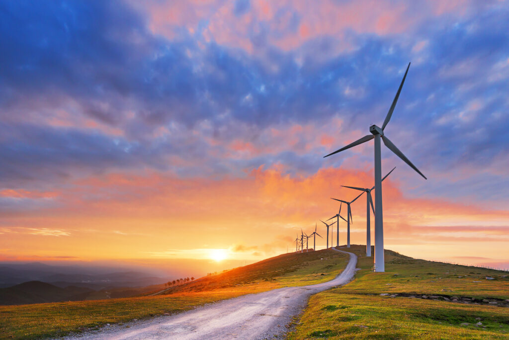 Wind turbines integrate with renewable energy sources like solar and storage systems